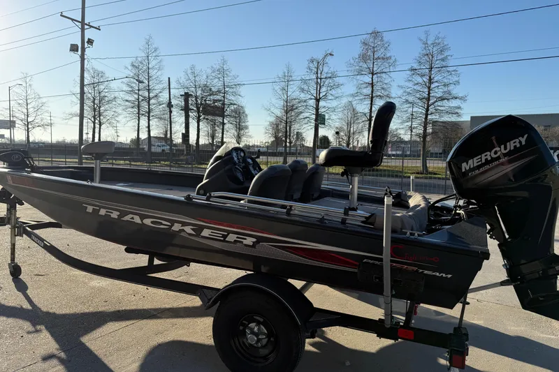 Slide: The Image of 2020 Tracker Pro Team 175 TF boat with Mercury engine on trailer, parked outdoors. - 5