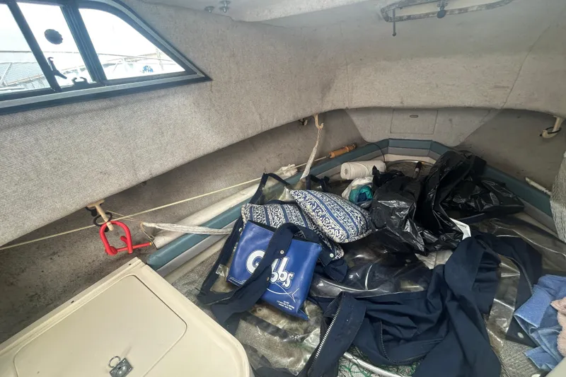 Slide: The Image of Interior cabin of 1992 Grady-White Sailfish 252 with assorted items and gear. - 17