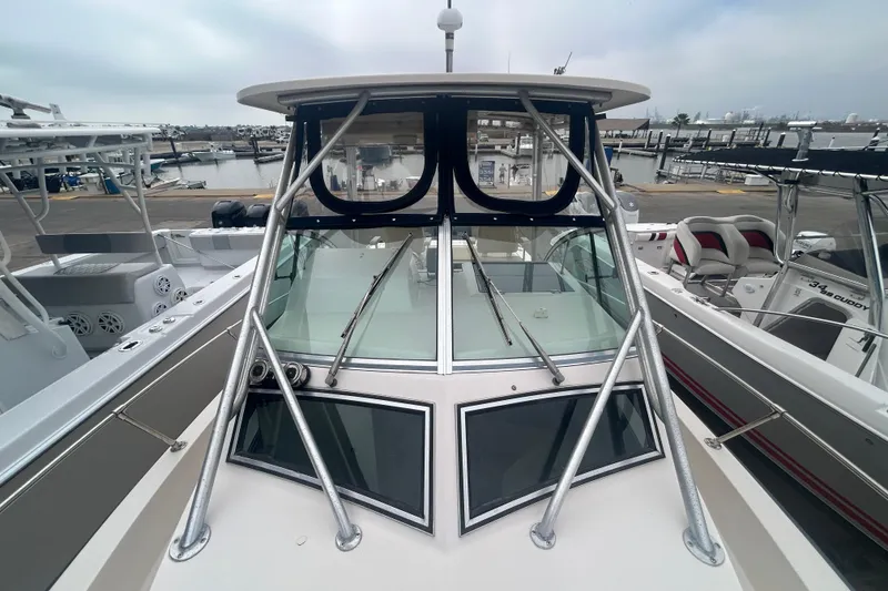 Slide: The Image of 1992 Grady-White Sailfish 252 boat at marina, showcasing sleek design and sturdy construction. - 33