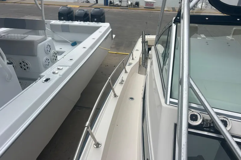 Slide: The Image of 1992 Grady-White Sailfish 252 boat docked, showcasing sleek design and sturdy construction. - 38