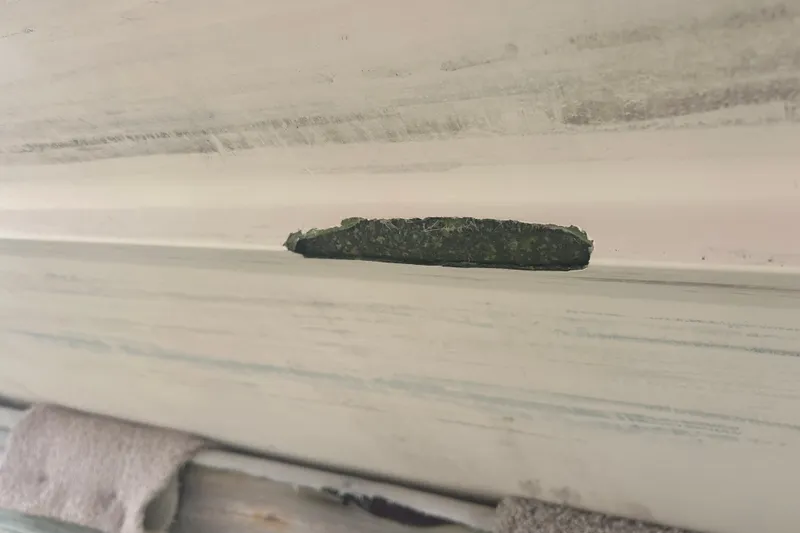 Slide: The Image of Close-up of damage on 1992 Grady-White Sailfish 252 boat hull. - 42