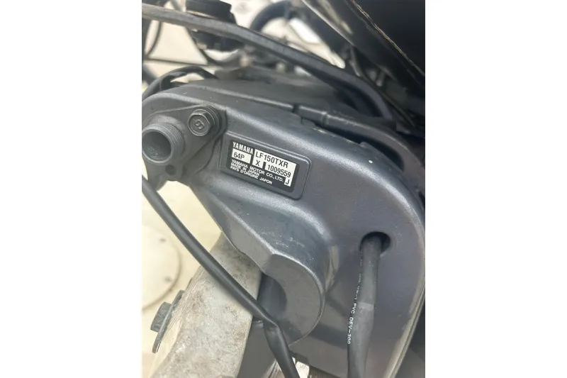 Slide: The Image of Close-up of Yamaha LF150TXR engine part on 1992 Grady-White Sailfish 252 boat. - 48