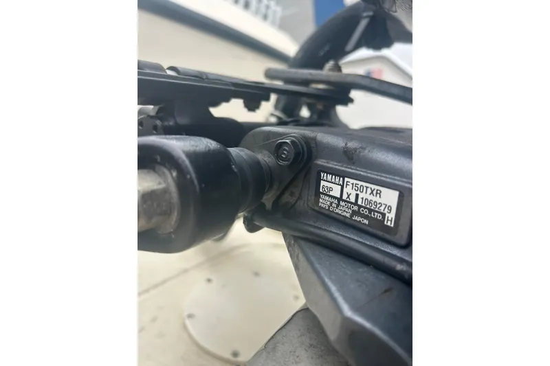 Slide: The Image of Close-up of Yamaha F150TXR engine part on 1992 Grady-White Sailfish 252 boat. - 49