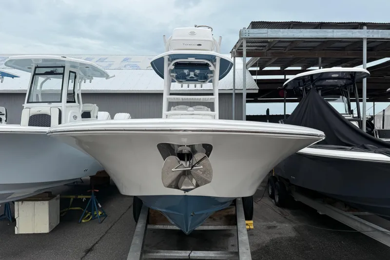 The Image of 2026 Tidewater 2700 Carolina Bay boat displayed in a marina, front view. - 1