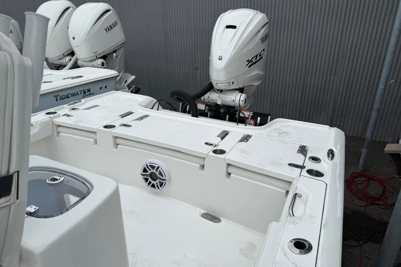 Slide: The Image of 2026 Tidewater 2700 Carolina Bay boat with Yamaha outboard engines, featuring a spacious deck. - 13