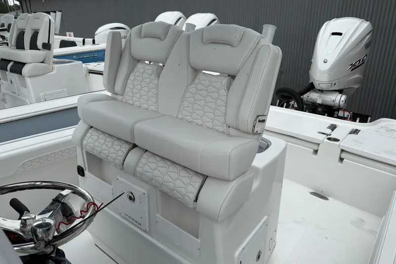 Slide: The Image of 2026 Tidewater 2700 Carolina Bay boat with dual seats and Yamaha outboard engine. - 14