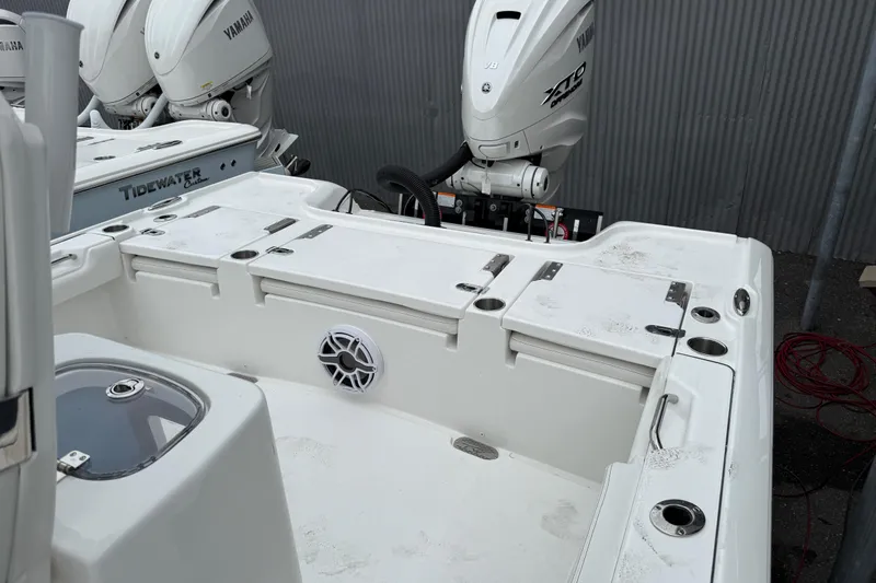 Slide: The Image of 2026 Tidewater 2700 Carolina Bay boat with Yamaha outboard engines, featuring a spacious deck. - 16