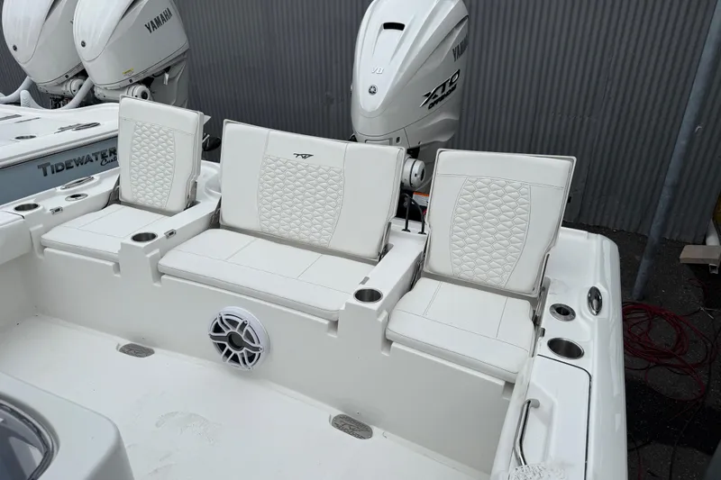 Slide: The Image of 2026 Tidewater 2700 Carolina Bay boat with Yamaha engines and white seating. - 17