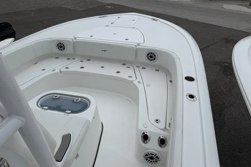 Slide: The Image of 2026 Tidewater 2700 Carolina Bay boat interior with seating and storage compartments. - 8