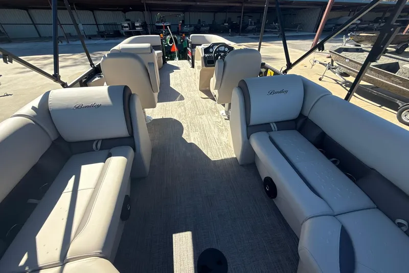 Slide: The Image of 2026 Bentley Pontoons Legacy 243 Navigator interior with luxurious seating and modern design. - 10
