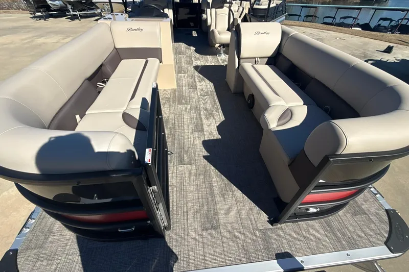 Slide: The Image of 2026 Bentley Pontoons Legacy 243 Navigator interior with luxurious seating and spacious layout. - 5