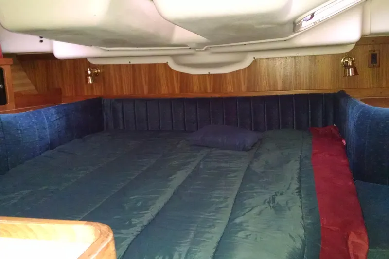 Slide: The Image of Cozy cabin interior of a 1999 Catalina 400 sailboat with a comfortable bed. - 10