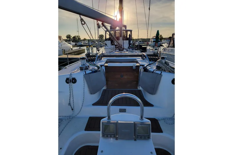 Slide: The Image of Sailboat deck view of 1999 Catalina 400 at sunset in marina. - 2