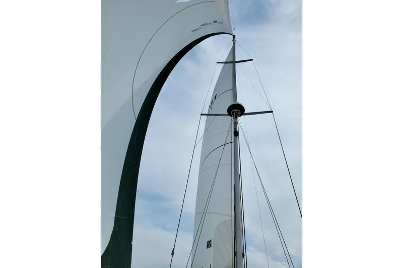 Slide: The Image of Sailboat mast and sails of a 1999 Catalina 400 against a cloudy sky. - 7