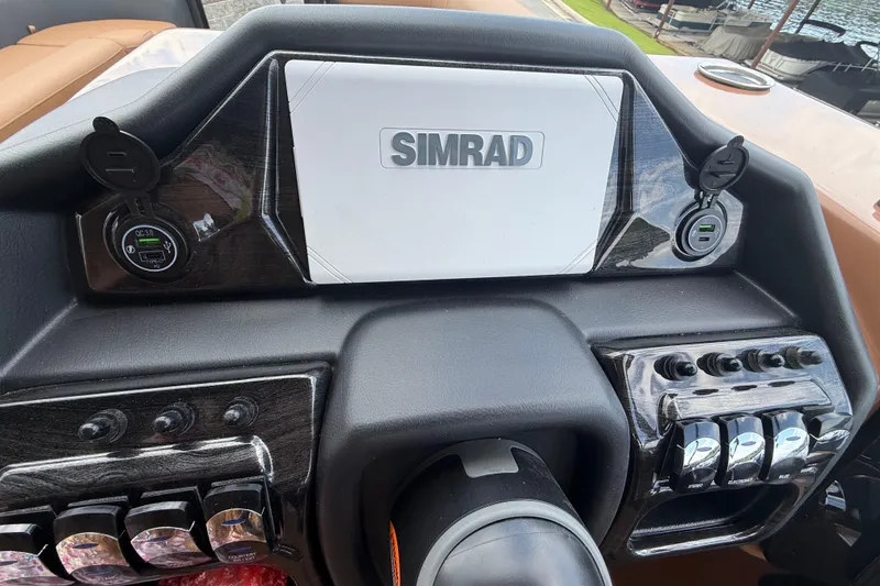 Slide: The Image of 2026 Bentley Pontoons Elite 253 Admiral dashboard with Simrad display and control panel. - 3