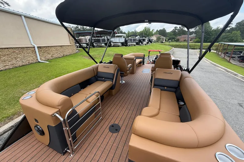 Slide: The Image of 2026 Bentley Pontoons Elite 253 Admiral with luxurious seating and canopy on display. - 6