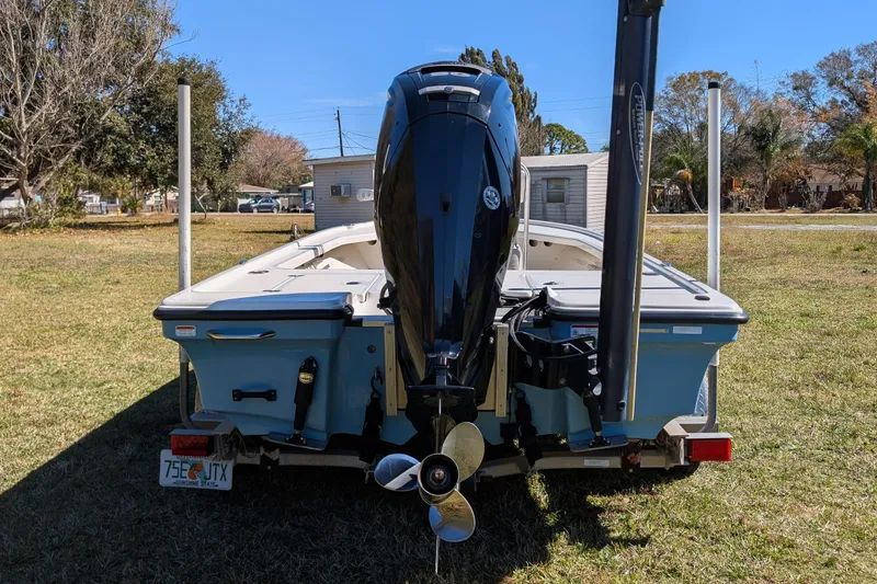 Slide: The Image of Rear view of a 2015 Mako 18 LTS boat with outboard motor on grass. - 6