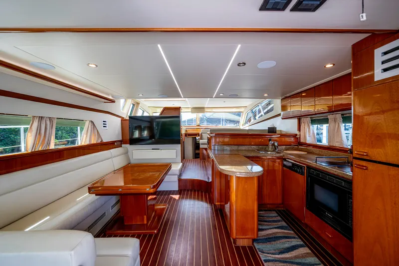 Slide: The Image of Luxurious interior of a 1997 Ferretti Yachts 650, featuring elegant wood finishes and modern amenities. - 22