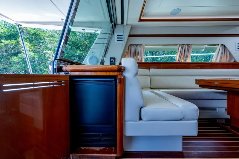Slide: The Image of Luxurious interior of 1997 Ferretti Yachts 650 with elegant seating and wooden accents. - 23