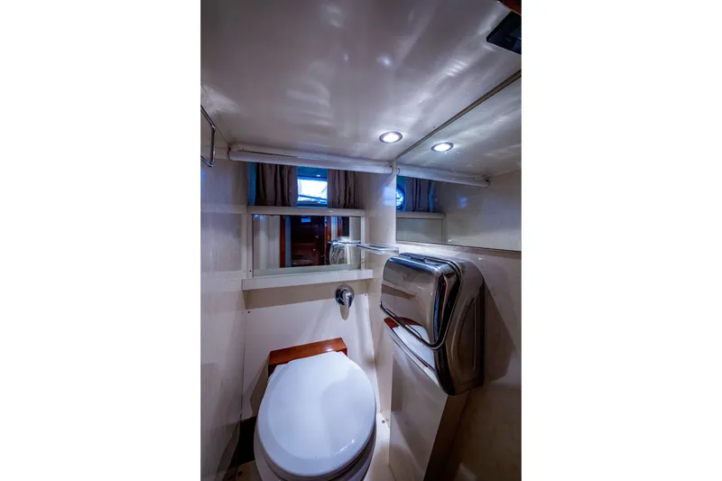 Slide: The Image of Luxurious bathroom interior of 1997 Ferretti Yachts 650 with modern fixtures. - 28
