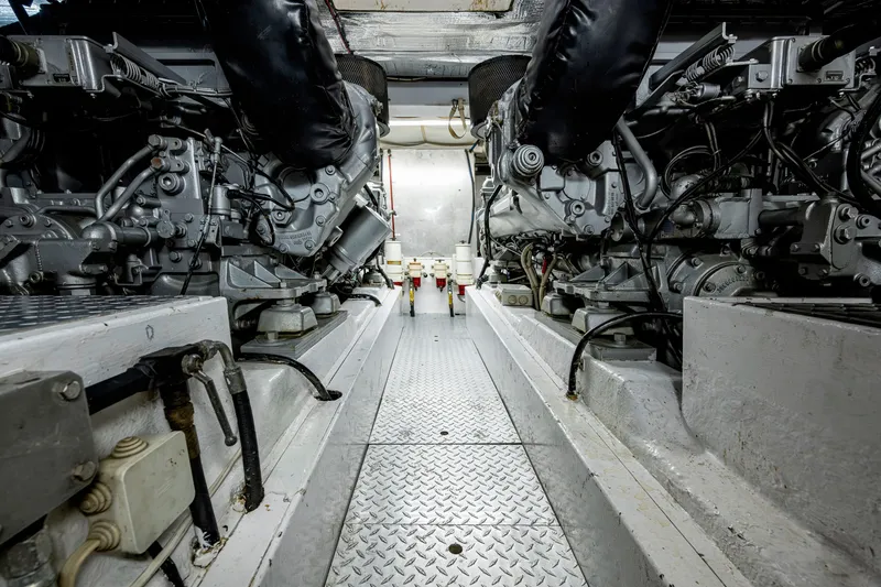 Slide: The Image of Engine room of a 1997 Ferretti Yachts 650, showcasing dual engines and mechanical components. - 29