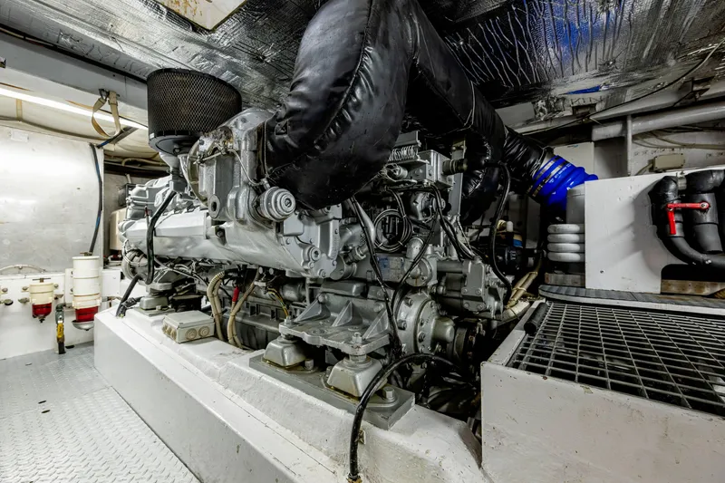 Slide: The Image of Engine room of a 1997 Ferretti Yachts 650, showcasing mechanical components and piping. - 31