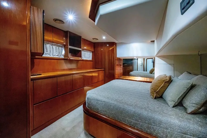Slide: The Image of Luxurious cabin interior of 1997 Ferretti Yachts 650 with elegant wood finish. - 34