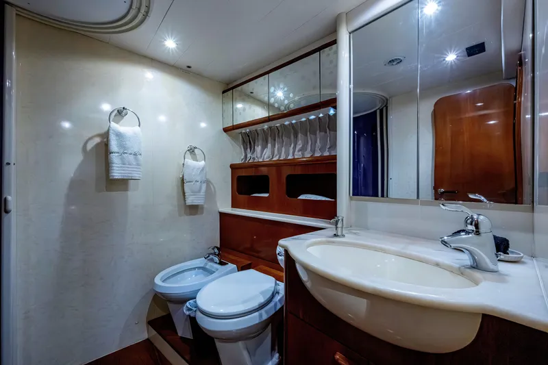 Slide: The Image of Luxurious bathroom in a 1997 Ferretti Yachts 650, featuring elegant fixtures and ample lighting. - 35