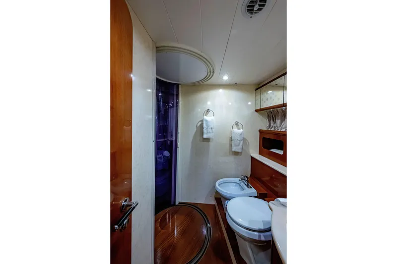 Slide: The Image of Luxurious bathroom interior of 1997 Ferretti Yachts 650 with elegant wood finishes. - 36