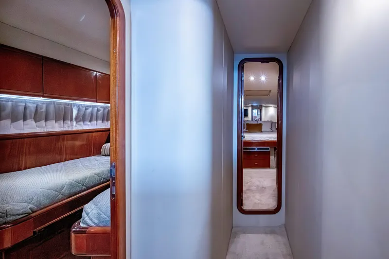 Slide: The Image of Hallway view inside 1997 Ferretti Yachts 650, featuring elegant wood finishes and cozy cabin. - 37
