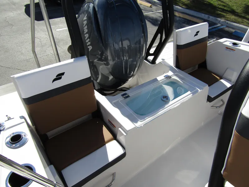 Slide: The Image of 2024 Starcraft SVX 191 OB CC boat interior with Yamaha engine and seating. - 31