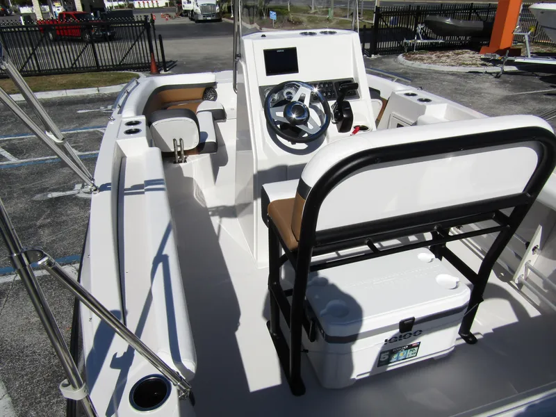 Slide: The Image of 2024 Starcraft SVX 191 OB CC boat interior with steering console and seating. - 39