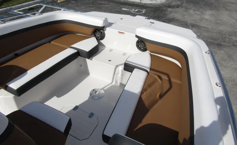 Slide: The Image of 2024 Starcraft SVX 191 OB CC boat interior with brown and white seating. - 9