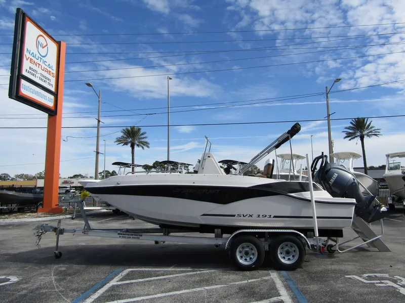 The Image of 2024 Starcraft SVX 191 OB CC boat on a trailer at a dealership. - 0