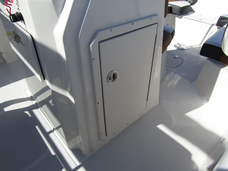 Slide: The Image of 2024 Starcraft SVX 191 OB CC center console storage compartment. - 20