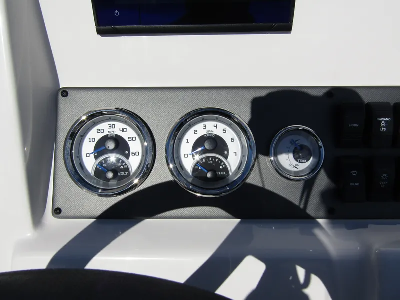 Slide: The Image of 2024 Starcraft SVX 191 OB CC dashboard with speedometer, fuel gauge, and other controls. - 25