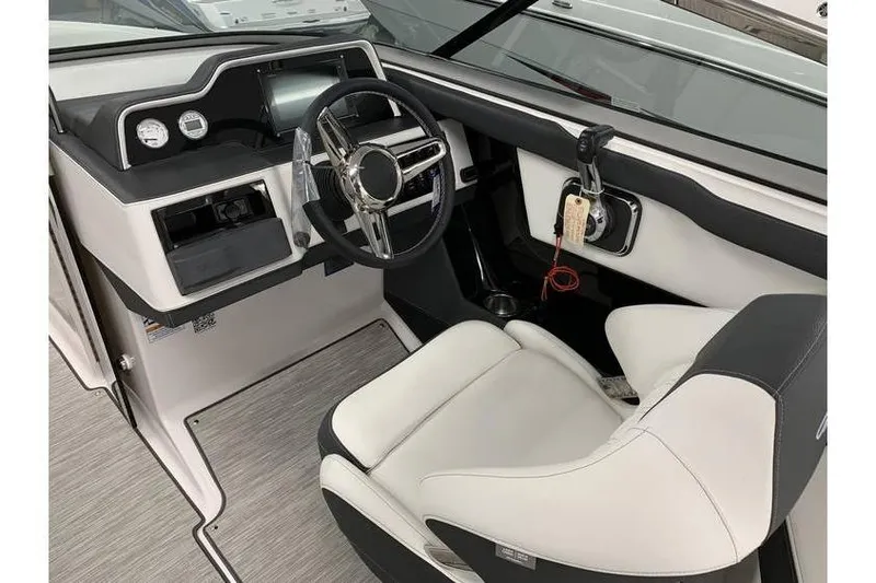 Slide: The Image of 2019 Regal 2500 Bowrider cockpit with modern steering wheel and dashboard controls. - 11