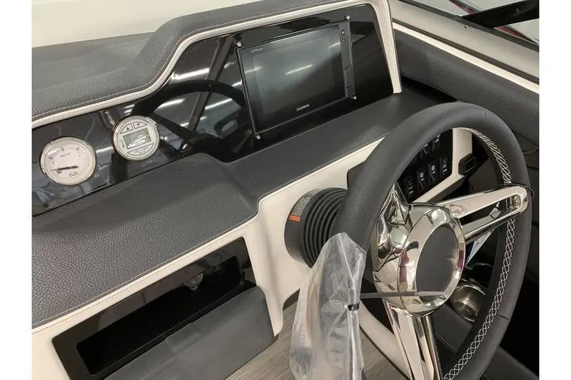 Slide: The Image of 2019 Regal 2500 Bowrider dashboard with steering wheel and navigation display. - 13