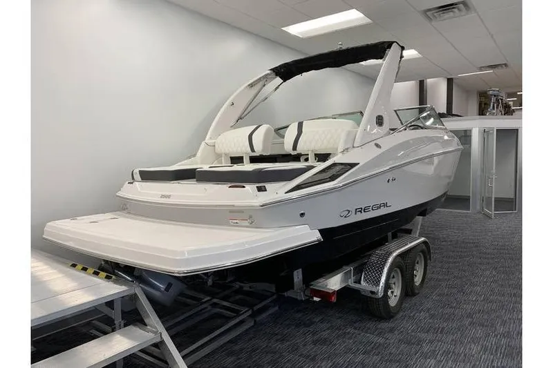Slide: The Image of 2019 Regal 2500 Bowrider boat on trailer in showroom setting. - 3