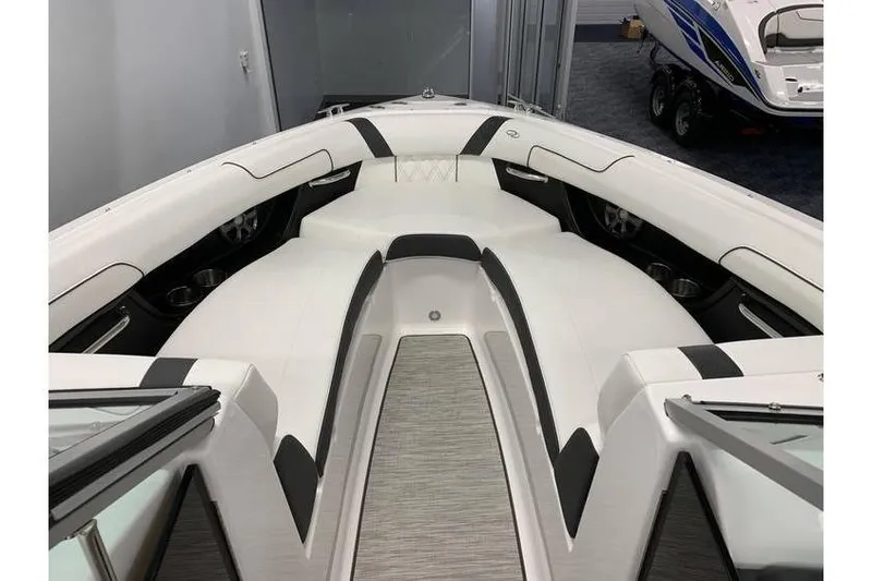 Slide: The Image of 2019 Regal 2500 Bowrider interior with sleek white and black seating design. - 7