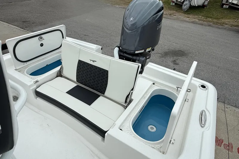 Slide: The Image of 2026 Tidewater 2210 Carolina Bay boat with seating and storage compartments. - 12