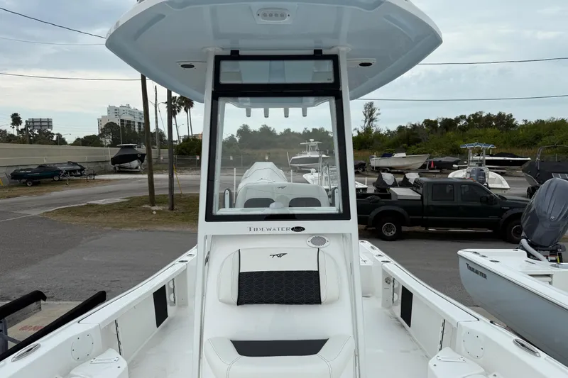 Slide: The Image of 2026 Tidewater 2210 Carolina Bay boat in marina, showcasing sleek design and spacious deck. - 9