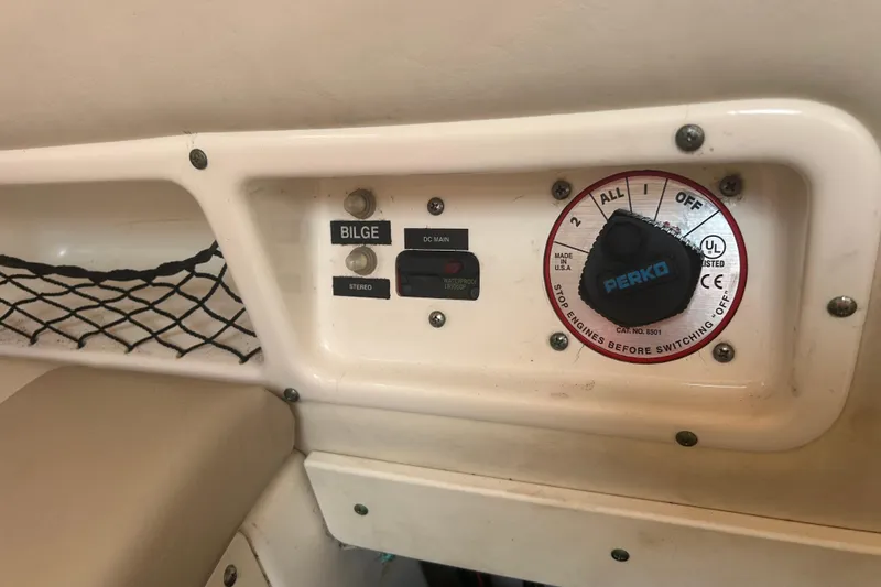 Slide: The Image of Control panel of a 2005 Boston Whaler 205 Eastport boat with Perko switch. - 17
