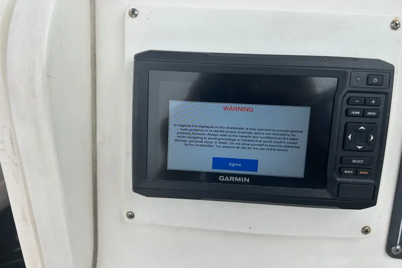 Slide: The Image of Garmin chartplotter warning screen on 2005 Boston Whaler 205 Eastport boat. - 21