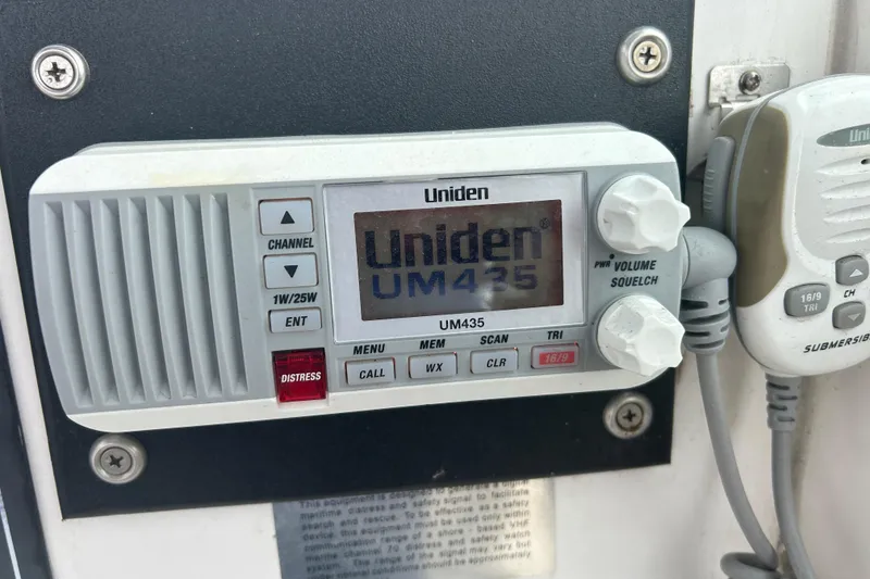 Slide: The Image of Uniden UM435 marine radio on 2005 Boston Whaler 205 Eastport boat dashboard. - 22