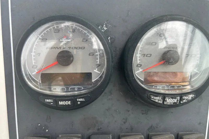 Slide: The Image of Dashboard gauges of a 2005 Boston Whaler 205 Eastport boat. - 25