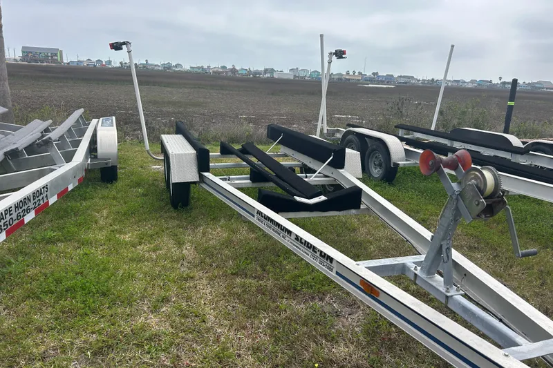 Slide: The Image of Boat trailers on grass, suitable for 2005 Boston Whaler 205 Eastport. - 26