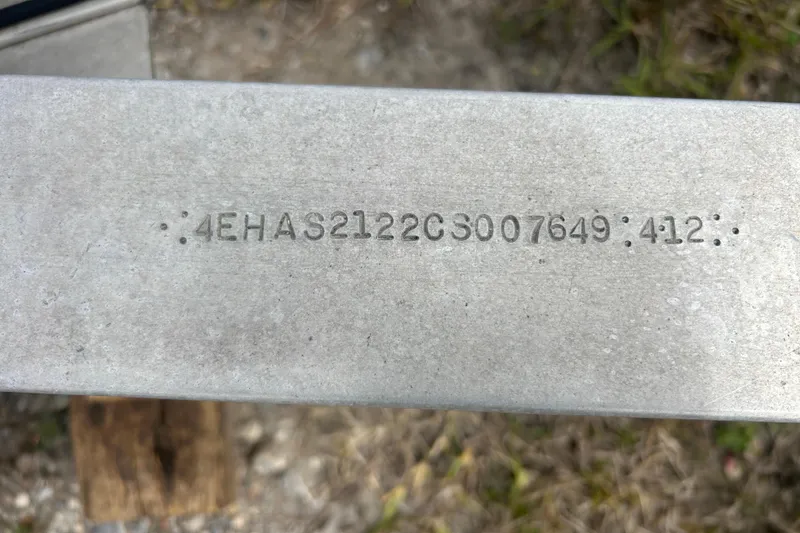 Slide: The Image of Serial number on metal surface of 2005 Boston Whaler 205 Eastport boat. - 29