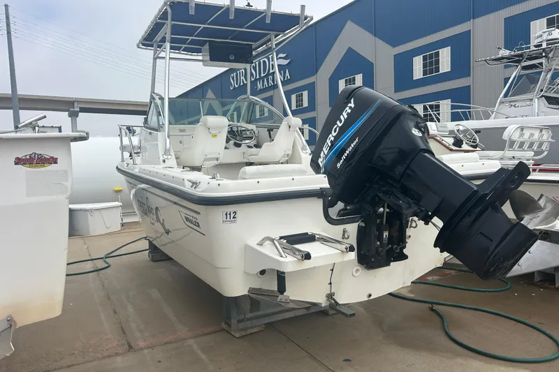 Slide: The Image of 2005 Boston Whaler 205 Eastport boat with Mercury engine at marina dock. - 3