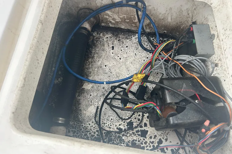 Slide: The Image of Electrical wiring and components inside a 2005 Boston Whaler 205 Eastport boat compartment. - 32